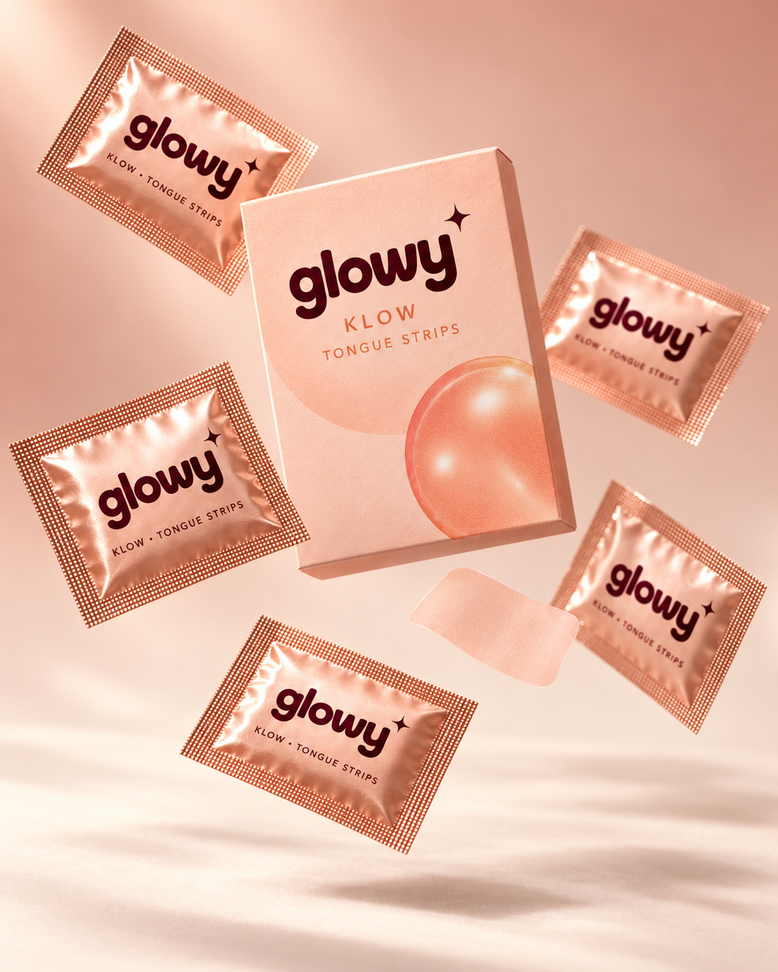 Glowy KLOW box and sachets floating in a soft peach setting